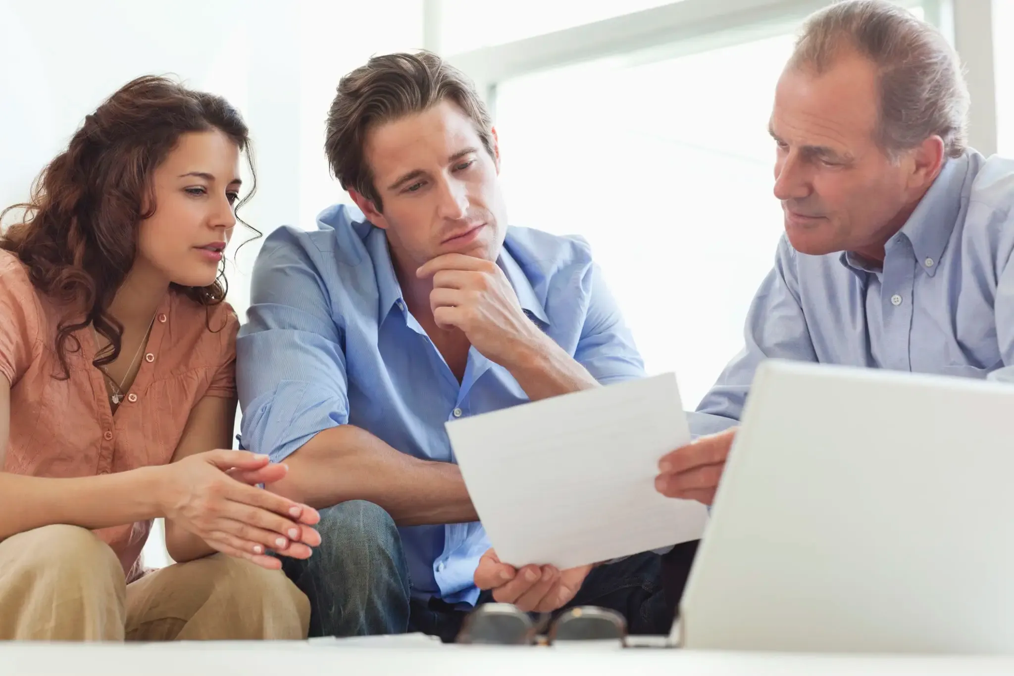couple-going-over-paperwork-with